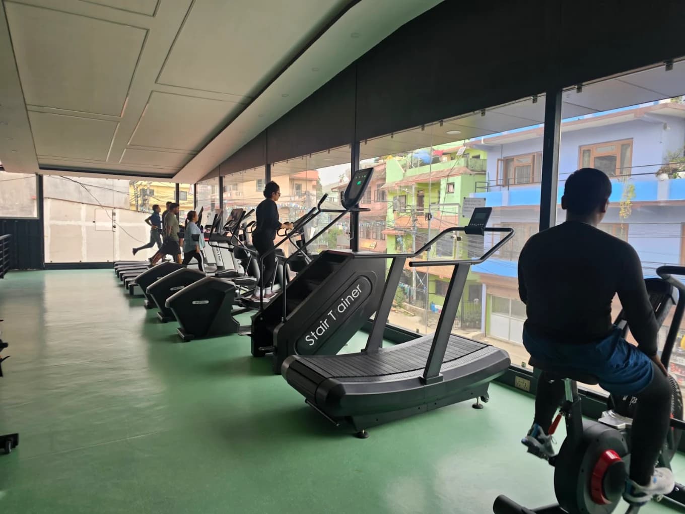 Cardio zone with treadmills and exercise bikes at Fitness 24x7